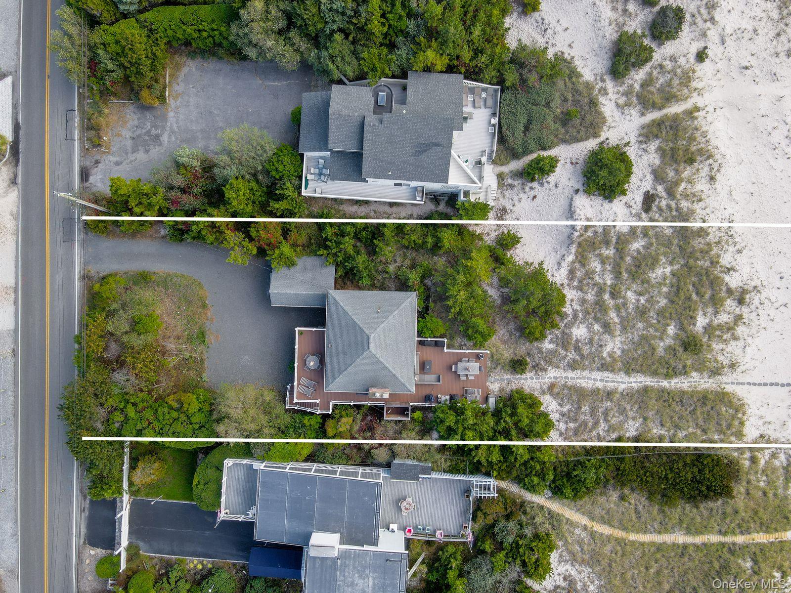 645 Dune Road Westhampton, NY 11978 - Photo 7 of 30 an aerial view of a house with a yard