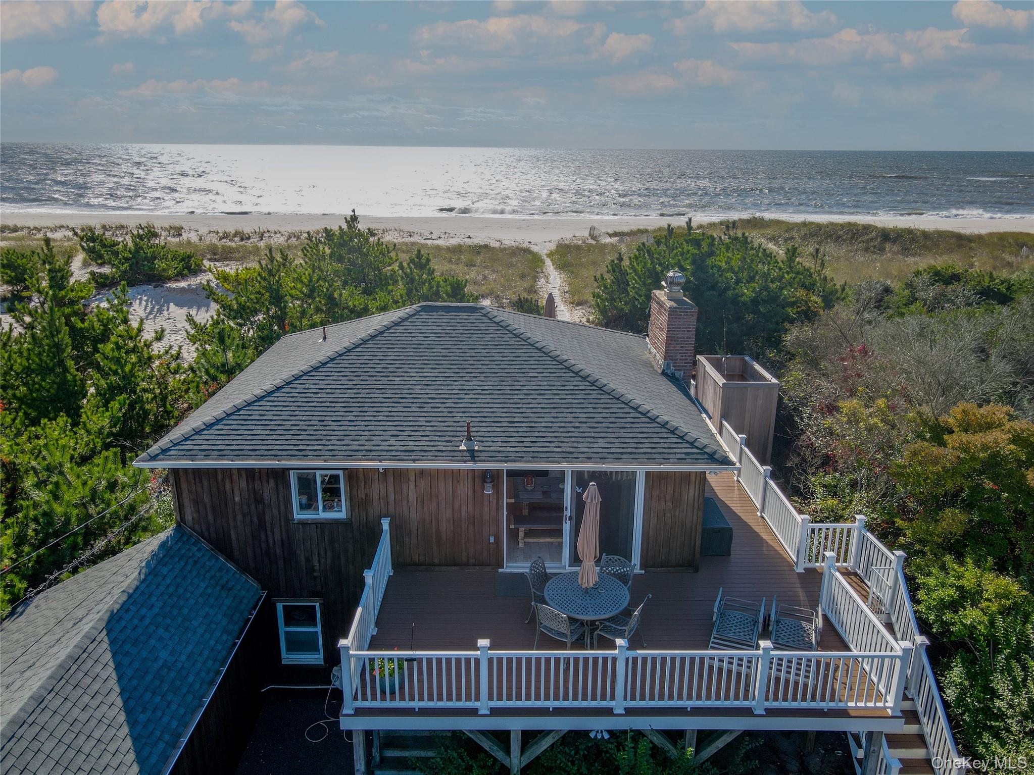 645 Dune Road Westhampton, NY 11978 - Photo 10 of 30 a aerial view of a house roof deck