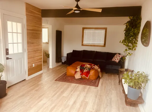 a living room with furniture and a window