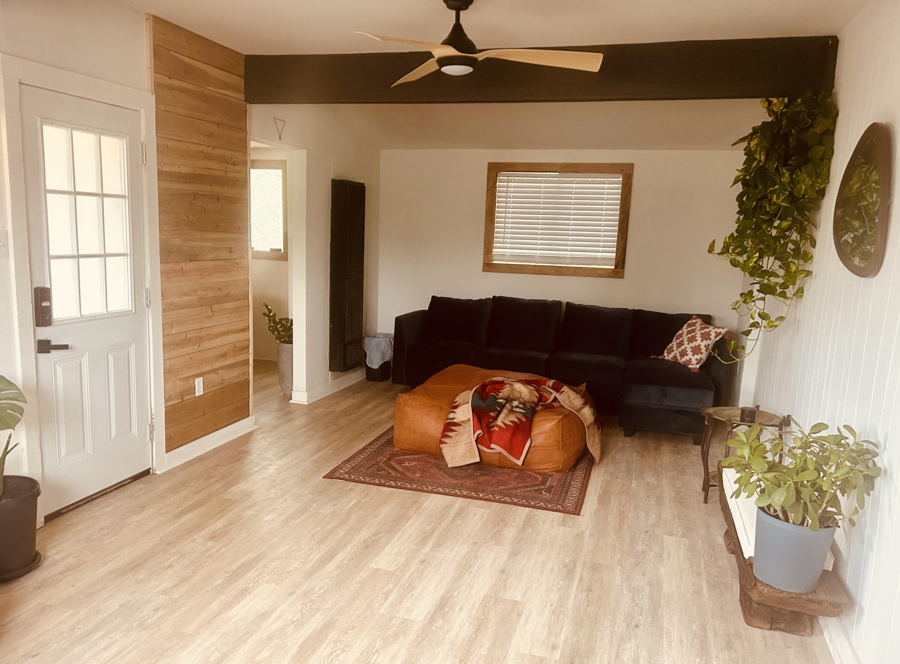 2436 24th Street, Unit BACK Lubbock, TX 79411 - Photo 2 of 6 a living room with furniture and a window