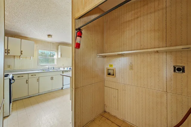 a bathroom with a granite countertop sink mirror and a shower