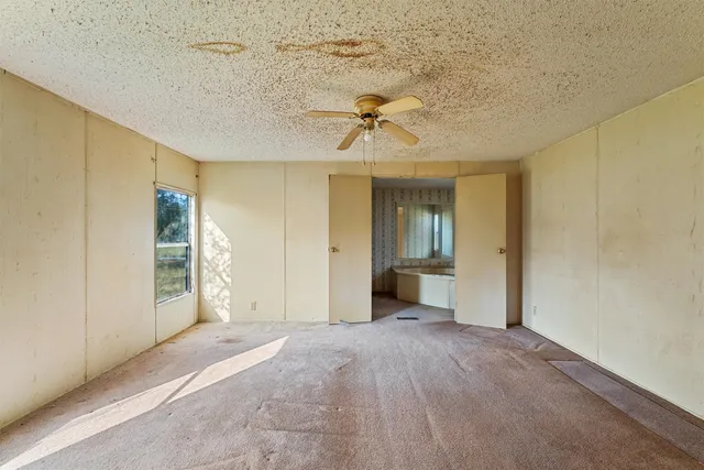 a view of a big room with windows and cabinet