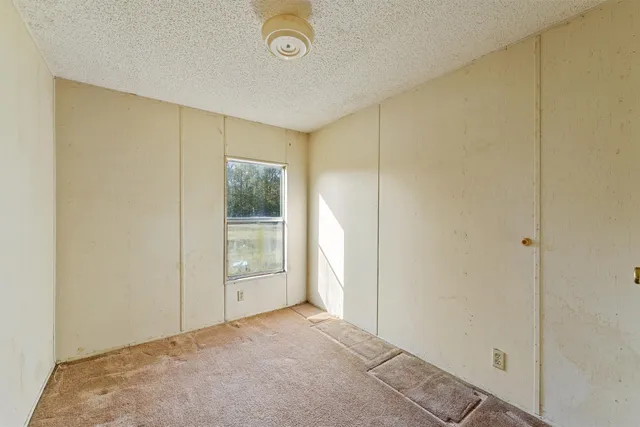 a view of an empty room and window
