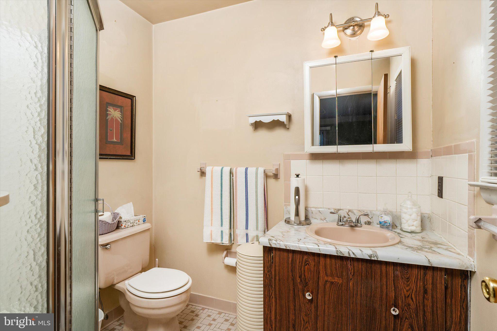 52 Castleton Drive Toms River, NJ 08757 - Photo 21 of 28 a bathroom with a granite countertop sink toilet and mirror