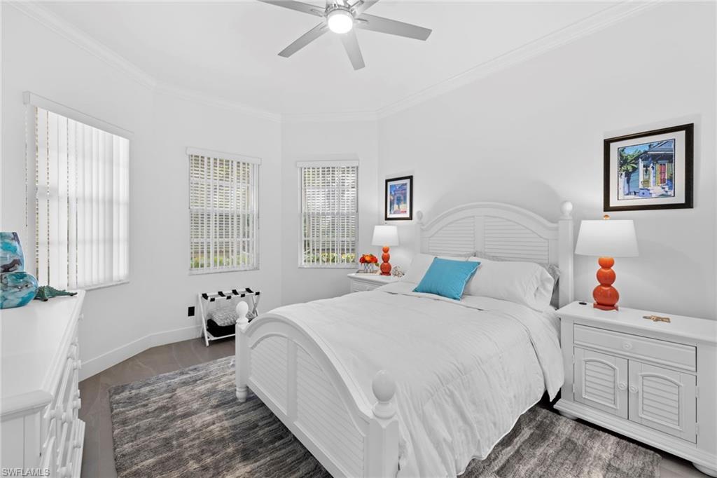 6903 Mauna Loa Lane Naples, FL 34113 - Photo 30 of 46 a bedroom with a bed and a window