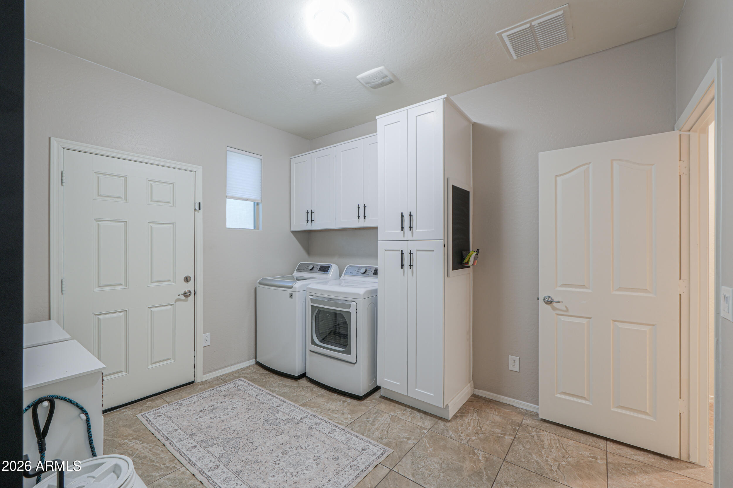 4575 East Waterman Street Gilbert, AZ 85297 - Photo 29 of 48 Custom cabinets and utility door