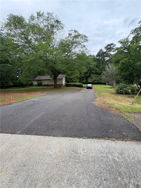 4897 Lou Ivy Road Peachtree Corners, GA 30096 - Photo 2 of 4 a view of a basket ball ground