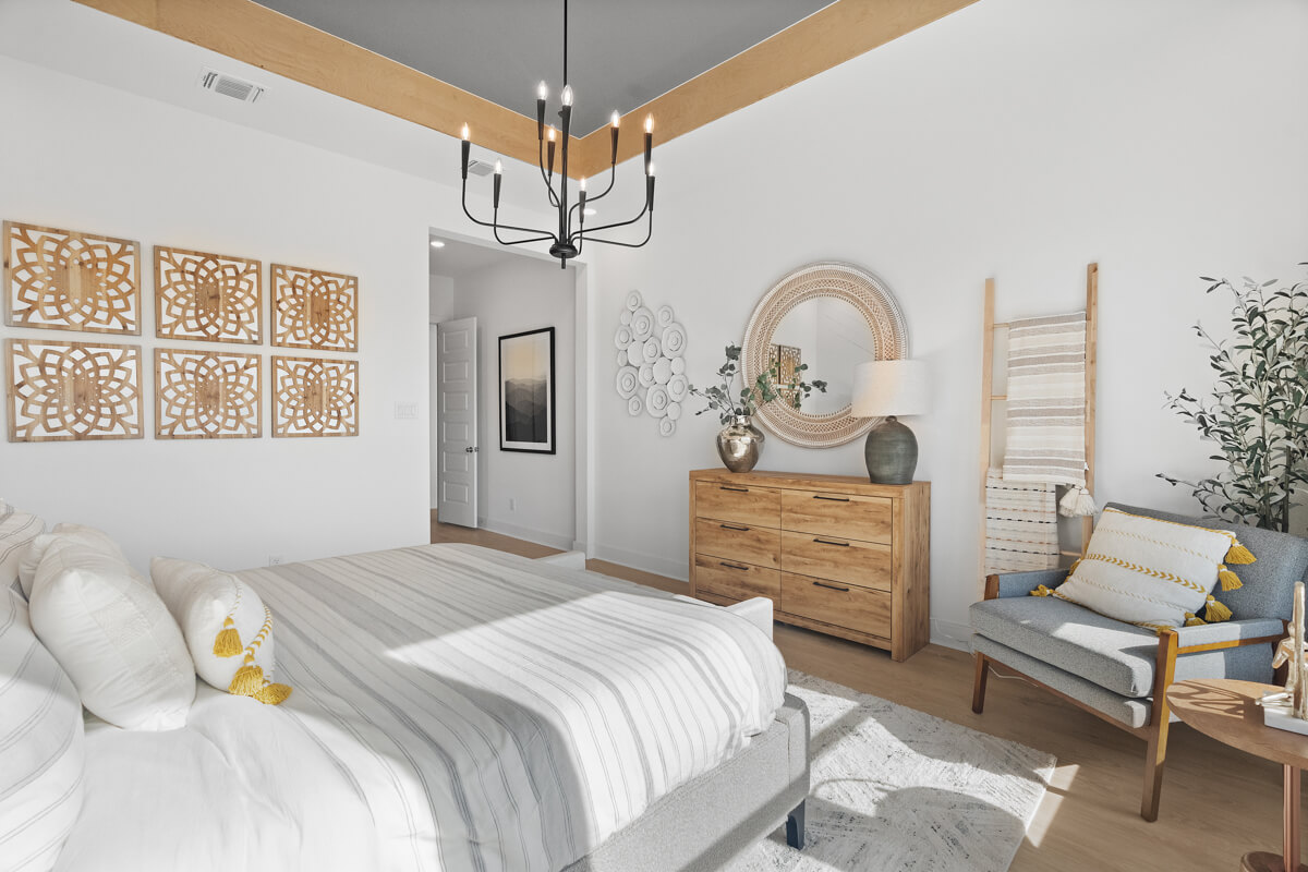 224 San Xavier Street Georgetown, TX 78633 - Photo 20 of 34 a bedroom with a bed and a chandelier