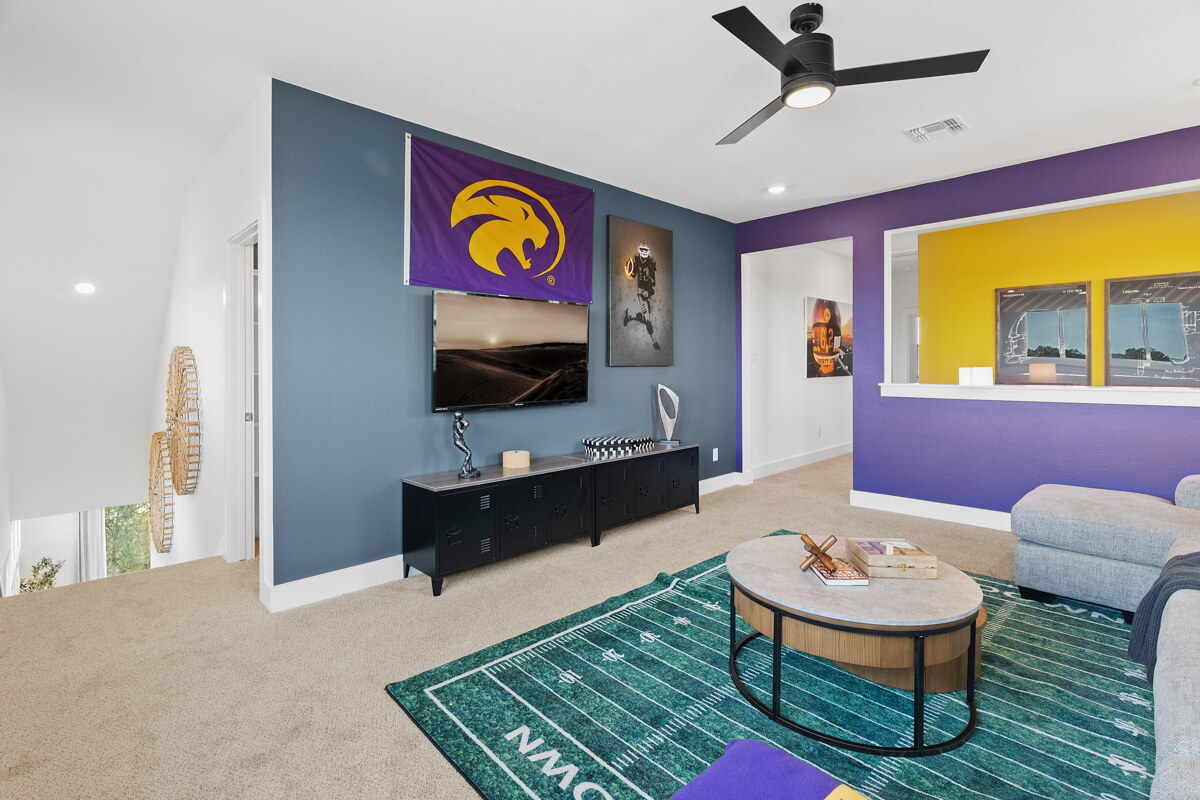 224 San Xavier Street Georgetown, TX 78633 - Photo 29 of 34 a living room with furniture and a flat screen tv