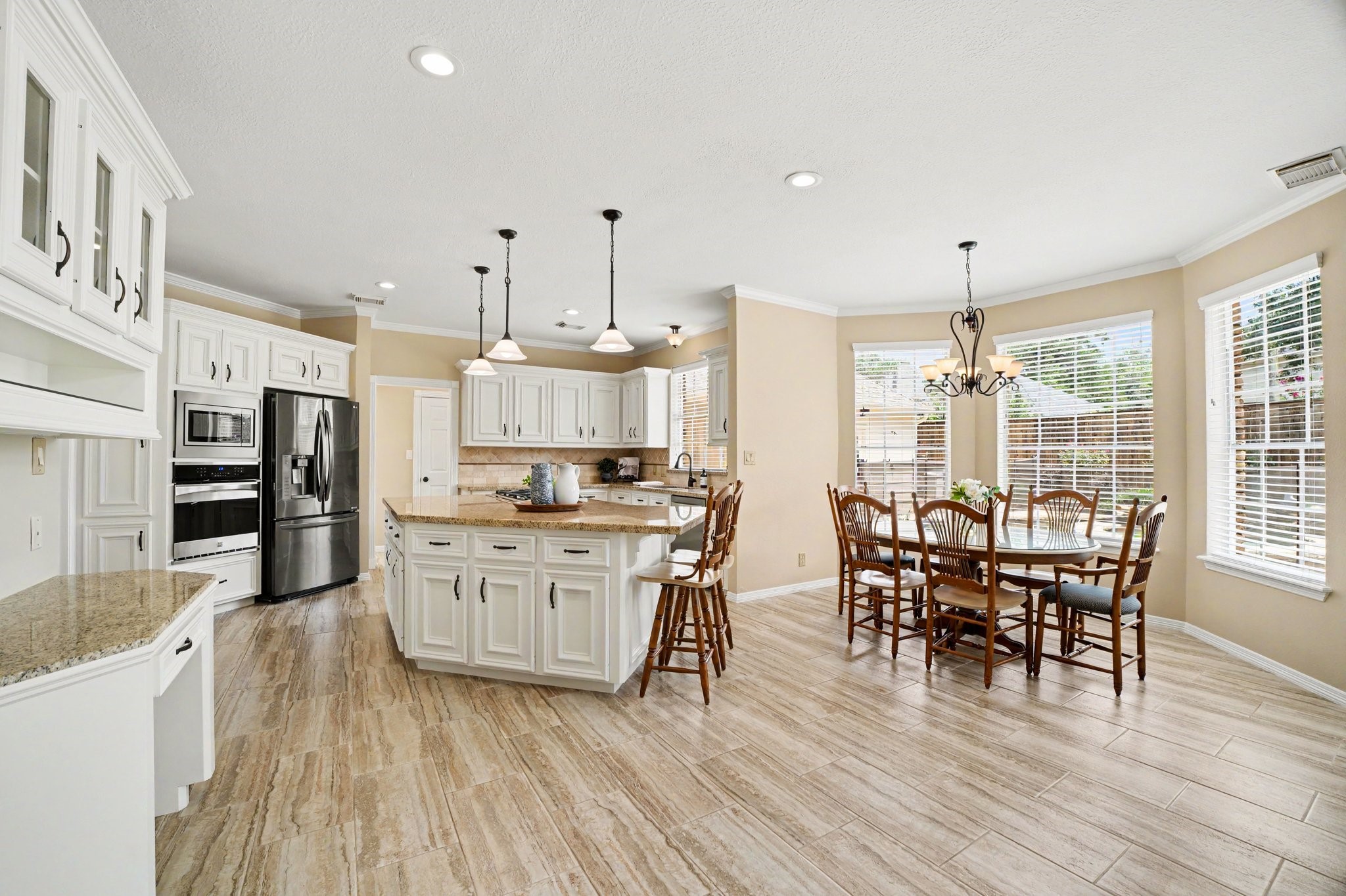 3411 Fir Forest Drive Spring, TX 77388 - Photo 10 of 39 Open concept and fully updated kitchen with oversized island and 5-burner gas cooktop, perfect for entertaining!