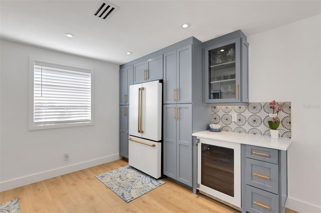 4360 Chatham Drive, Unit 108 Longboat Key, FL 34228 - Photo 14 of 56 a kitchen with stainless steel appliances granite countertop a refrigerator and a stove