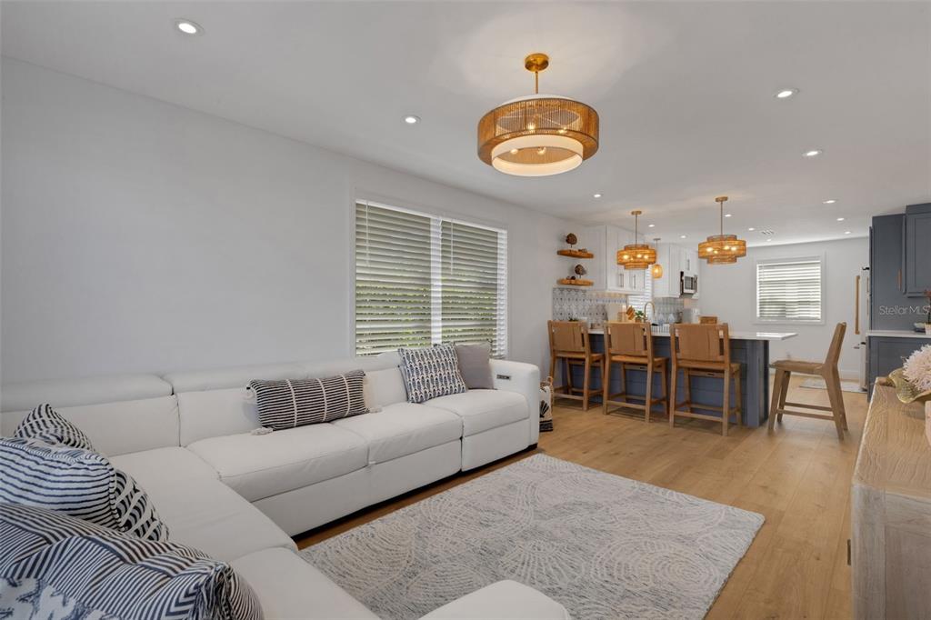 4360 Chatham Drive, Unit 108 Longboat Key, FL 34228 - Photo 21 of 56 a living room with furniture wooden floor and dining table