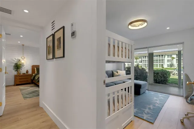 a bedroom with a bed couch and a window