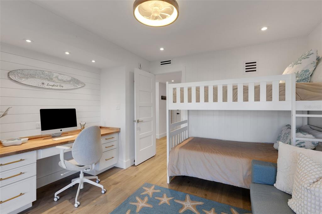 4360 Chatham Drive, Unit 108 Longboat Key, FL 34228 - Photo 25 of 56 a bedroom with furniture and a window