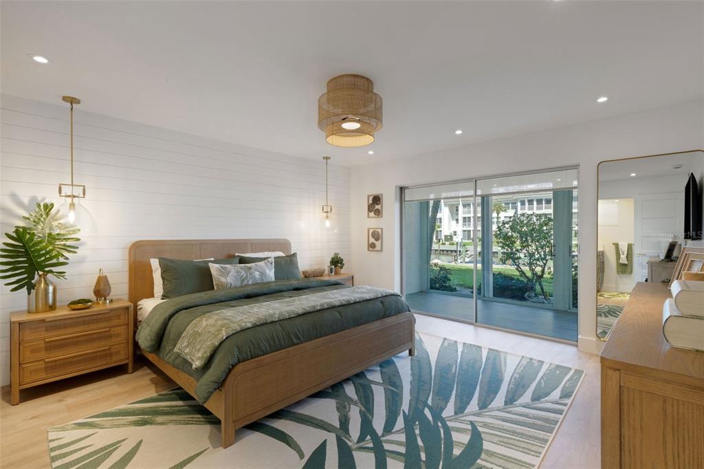 4360 Chatham Drive, Unit 108 Longboat Key, FL 34228 - Photo 27 of 56 a bedroom with a balcony a bed and a chandelier