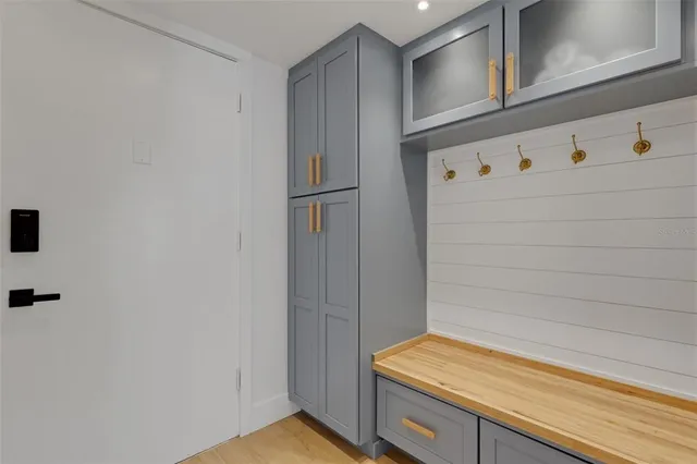 a view of storage and utility room with wooden floor