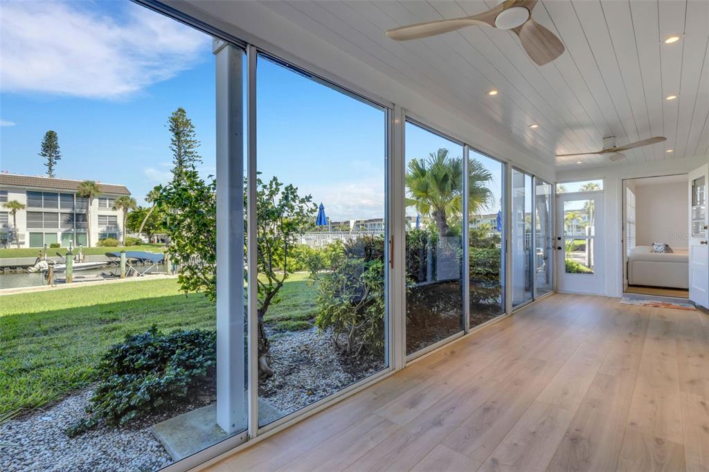 4360 Chatham Drive, Unit 108 Longboat Key, FL 34228 - Photo 35 of 56 a view of a porch and garden