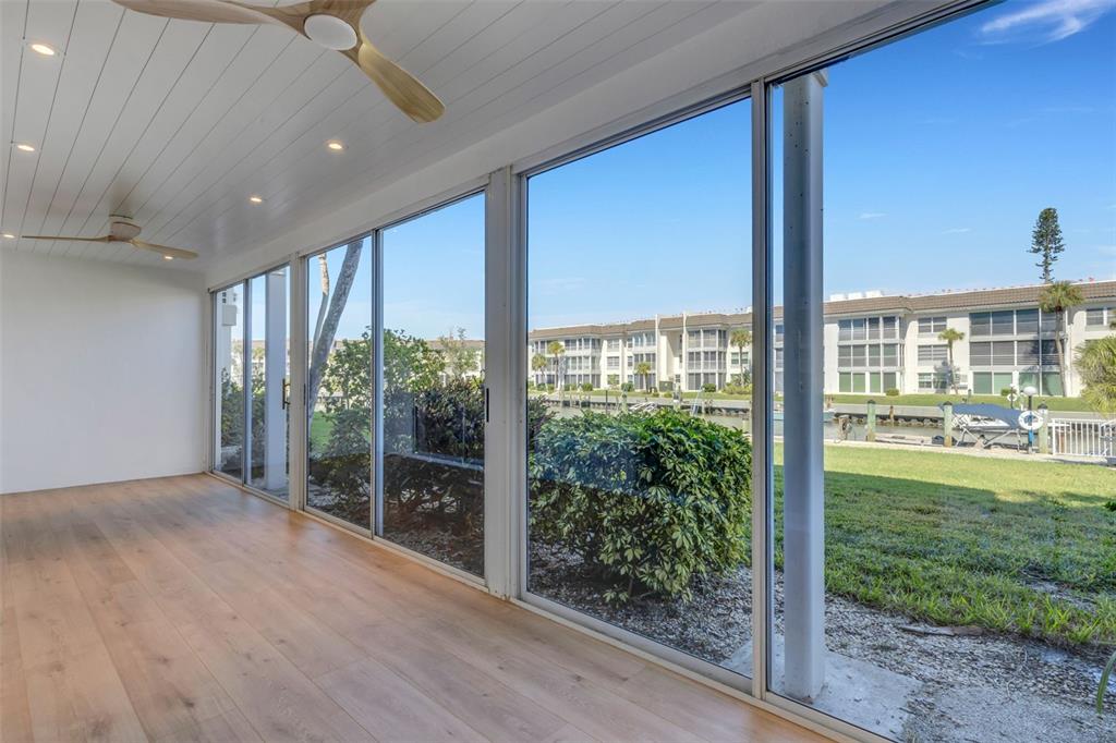 4360 Chatham Drive, Unit 108 Longboat Key, FL 34228 - Photo 38 of 56 a view of a room with a large window