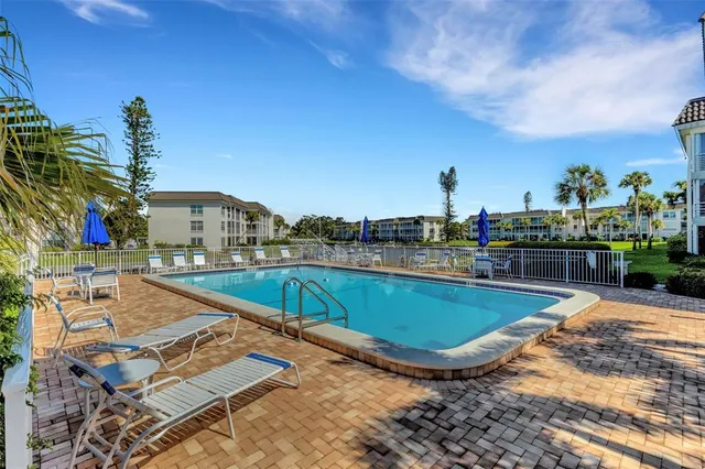 a view of a garden with a building in the background