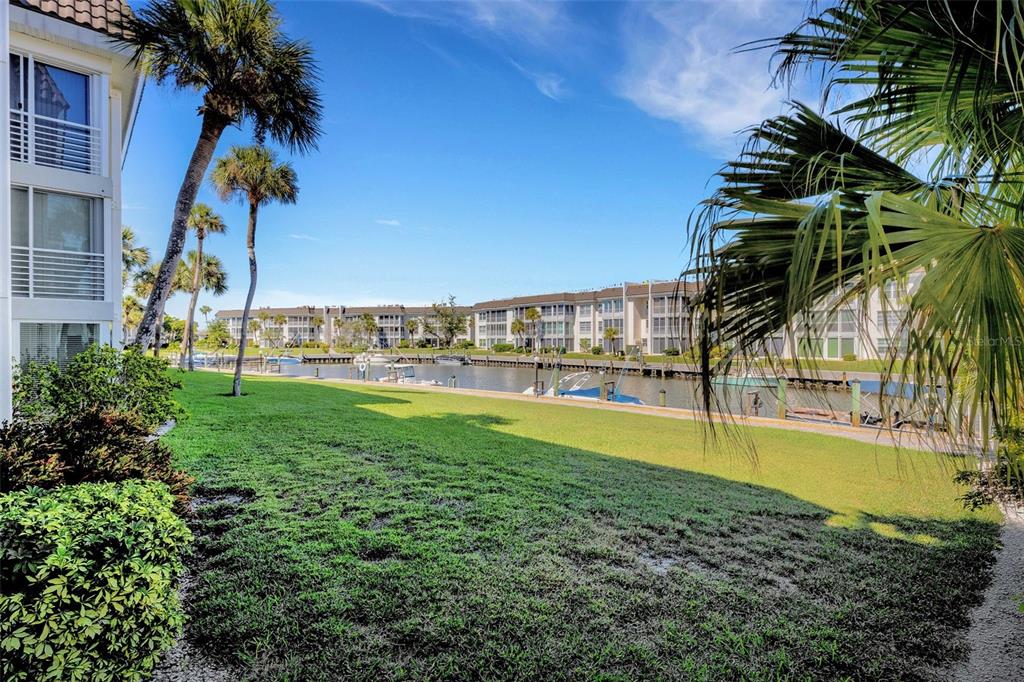 4360 Chatham Drive, Unit 108 Longboat Key, FL 34228 - Photo 41 of 56 a view of a swimming pool and a yard