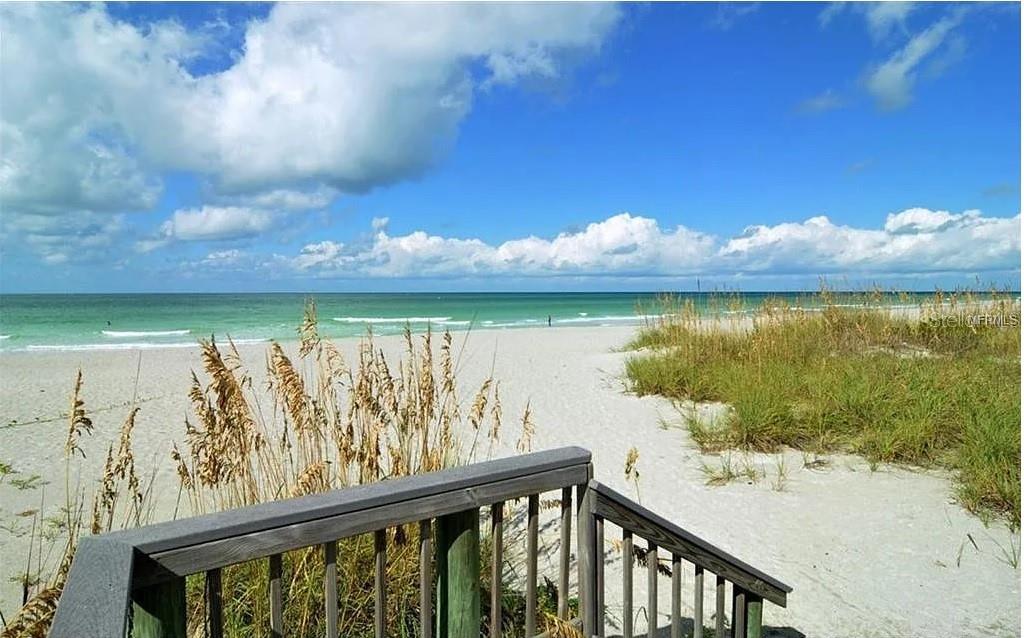 4360 Chatham Drive, Unit 108 Longboat Key, FL 34228 - Photo 44 of 56 a view of a lake from a balcony