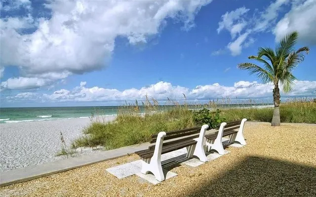 a backyard of a house with barbeque oven table and chairs