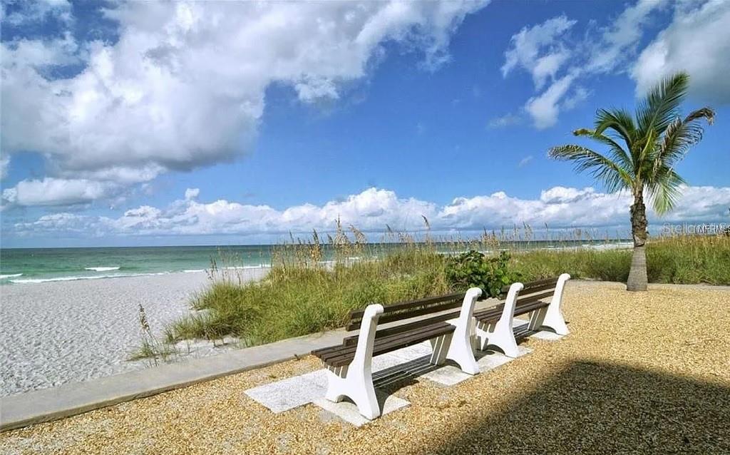 4360 Chatham Drive, Unit 108 Longboat Key, FL 34228 - Photo 45 of 56 a view of a lake with couches in the patio