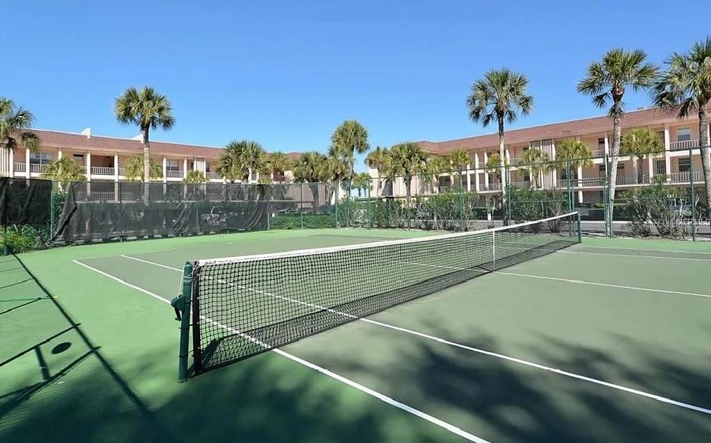 4360 Chatham Drive, Unit 108 Longboat Key, FL 34228 - Photo 46 of 56 a view of a tennis court