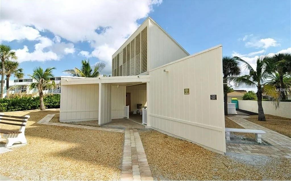 4360 Chatham Drive, Unit 108 Longboat Key, FL 34228 - Photo 56 of 56 a view of a house with a backyard