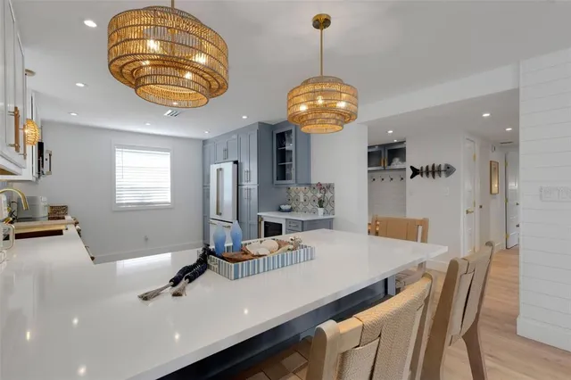 a kitchen with a table and chairs in it