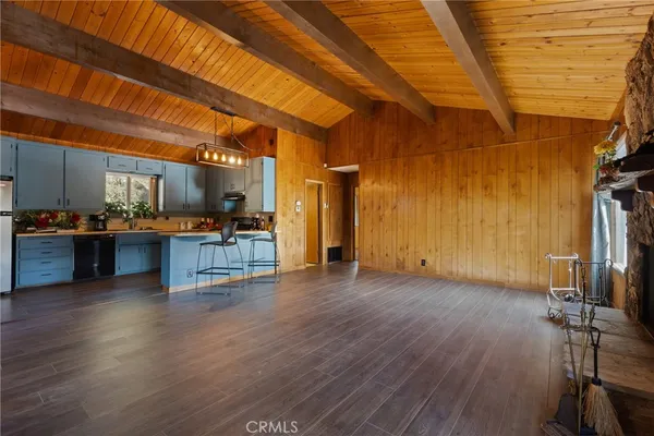a view of kitchen with furniture and wooden floor