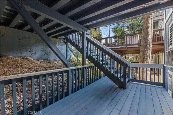 a view of balcony with wooden floor