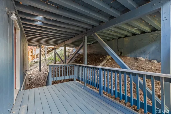 a view of deck with wooden floor and fence