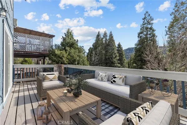 a view of roof deck with furniture