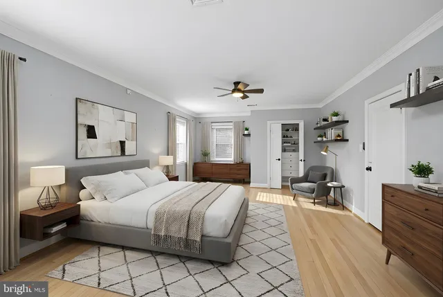 a view of empty room with wooden floor and window