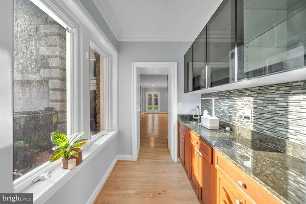 a view of a bathroom with a tub and a potted plant
