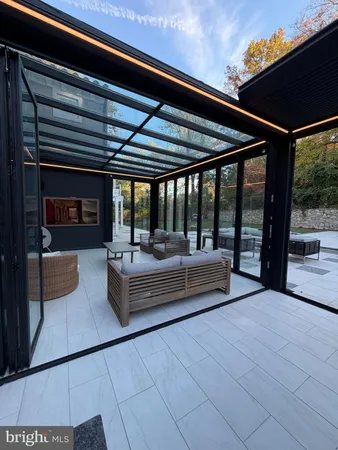 a view of living room with furniture and floor to ceiling window