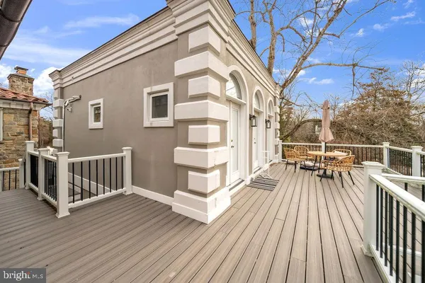 a view of a house with yard and sitting area