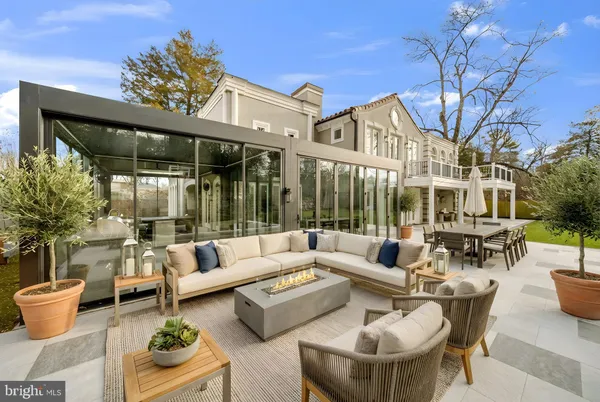 a view of a patio with couches table and chairs