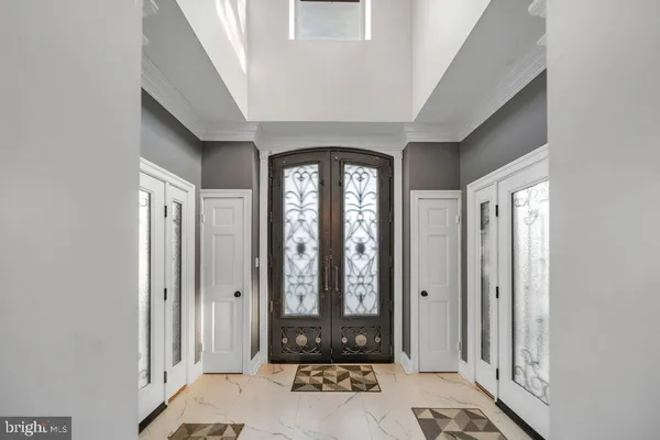 a view of a entryway door with couch