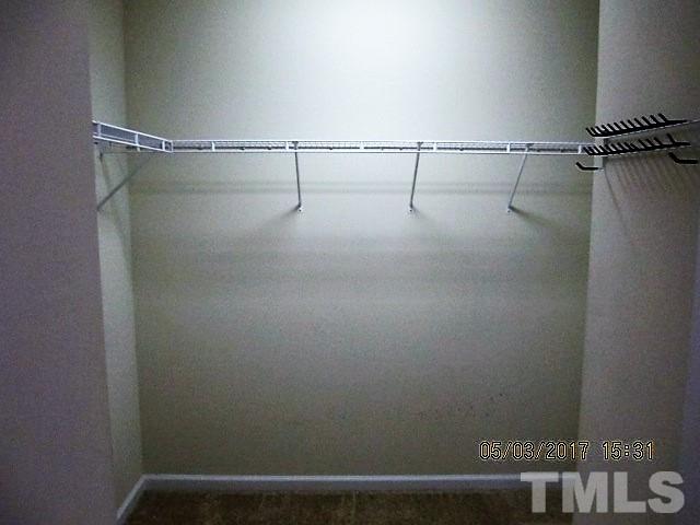 4305 Bay Rum Lane Raleigh, NC 27610 - Photo 12 of 17 a view of small space with racks on the wall