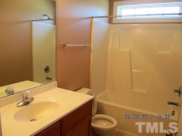 4305 Bay Rum Lane Raleigh, NC 27610 - Photo 17 of 17 a bathroom with a sink and a mirror