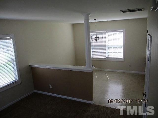 4305 Bay Rum Lane Raleigh, NC 27610 - Photo 7 of 17 an empty room with windows