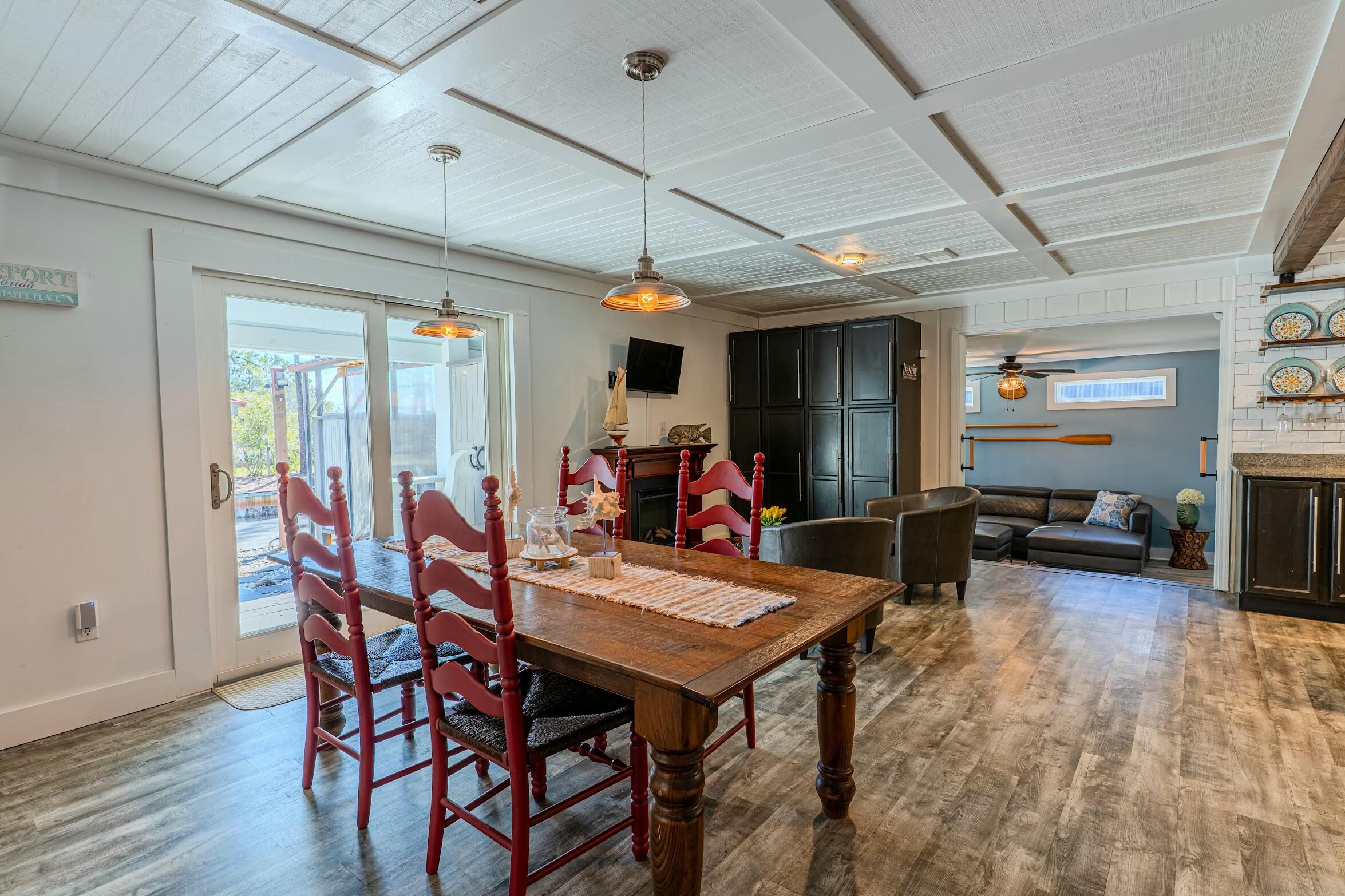 175 Ruth Road Freeport, FL 32439 - Photo 12 of 69 a view of a dining room with furniture window and wooden floor