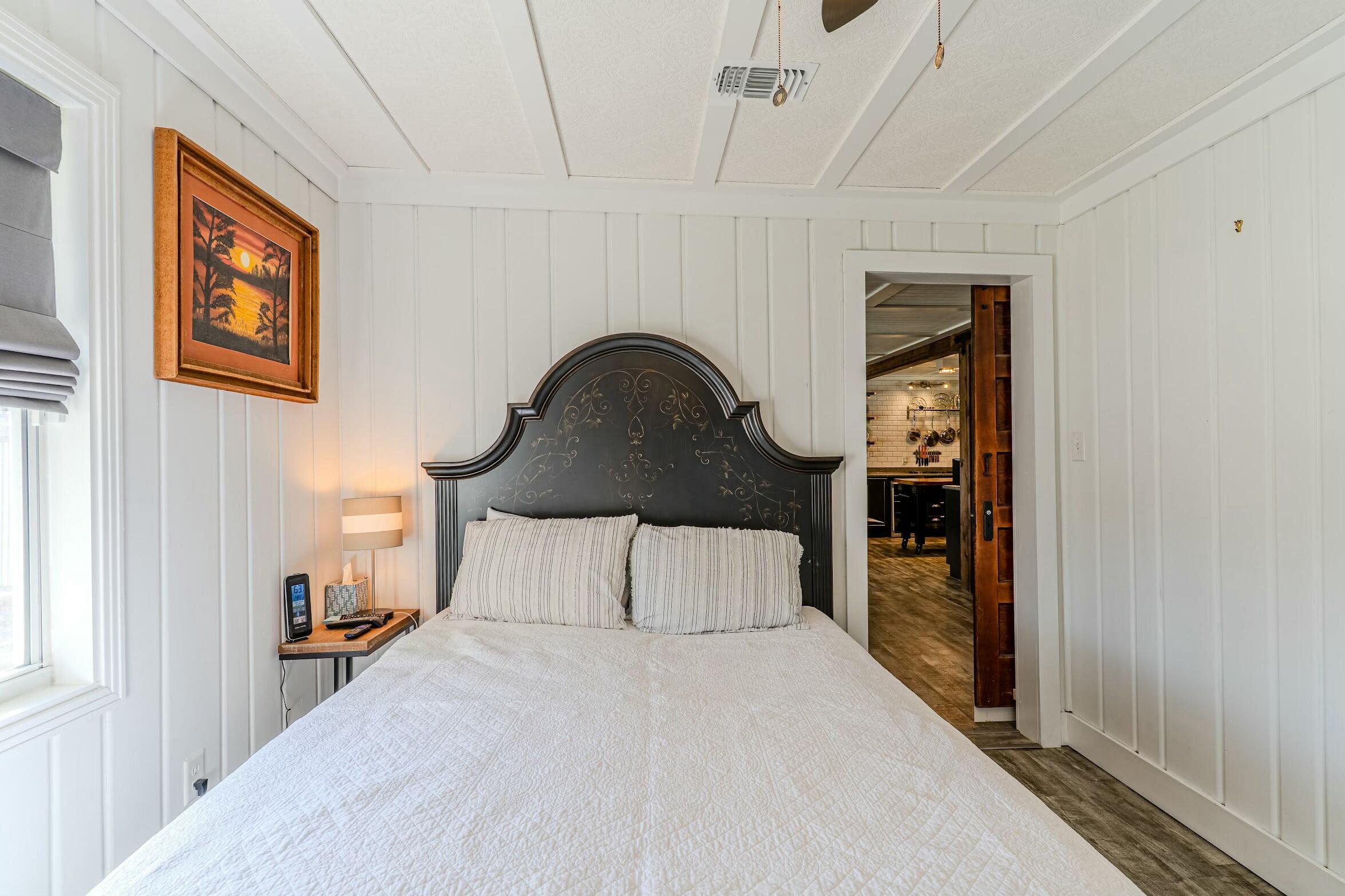 175 Ruth Road Freeport, FL 32439 - Photo 16 of 69 a bedroom with bed and a night stand