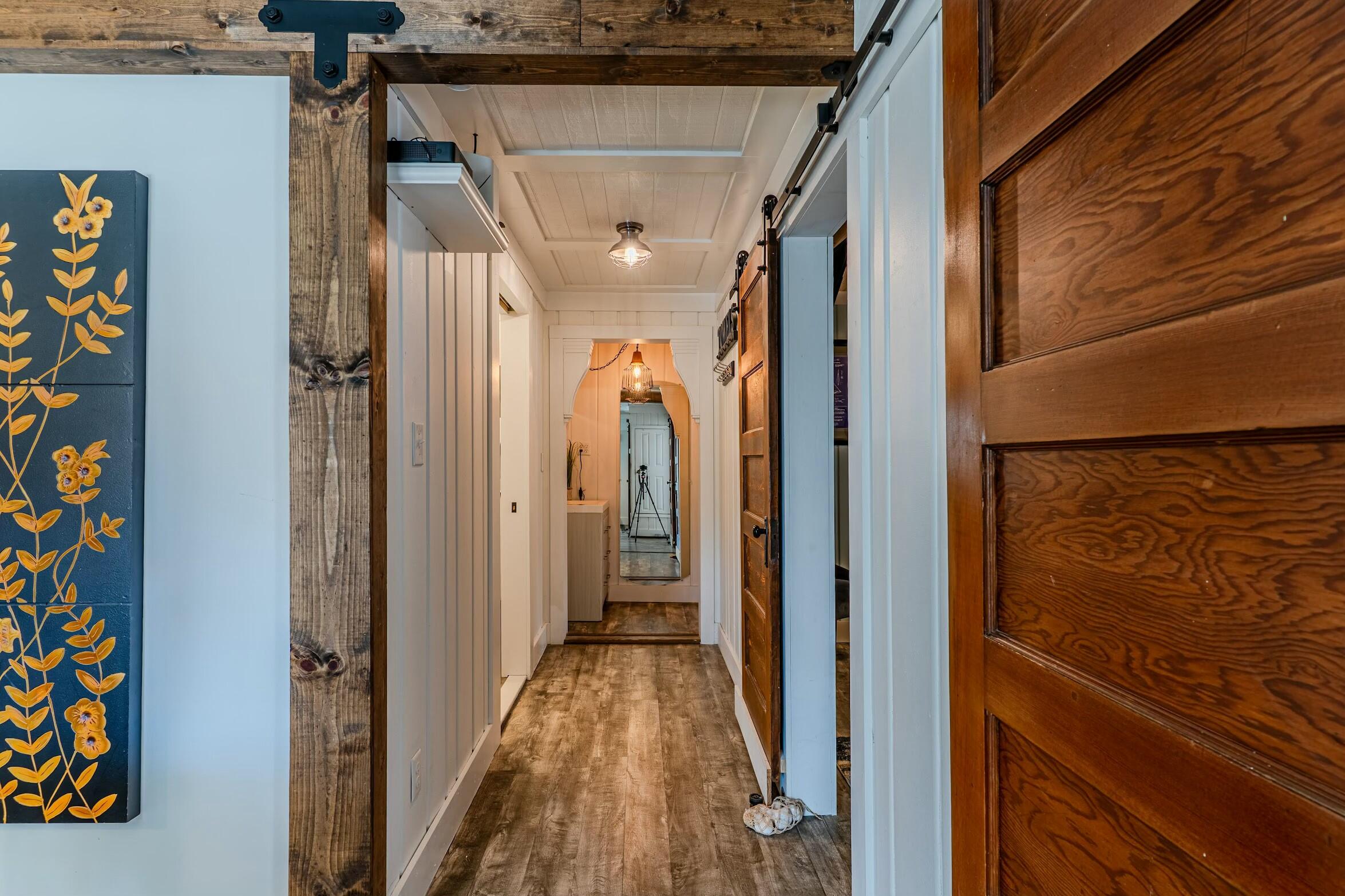 175 Ruth Road Freeport, FL 32439 - Photo 17 of 69 a view of a hallway with wooden floor and staircase