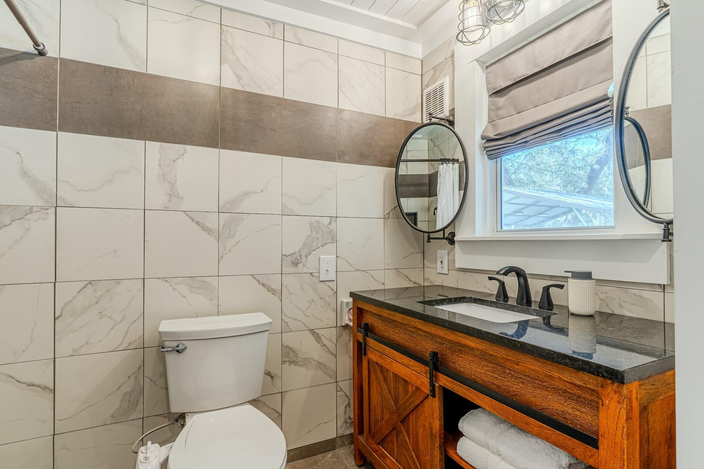 175 Ruth Road Freeport, FL 32439 - Photo 18 of 69 a bathroom with a toilet a sink and mirror
