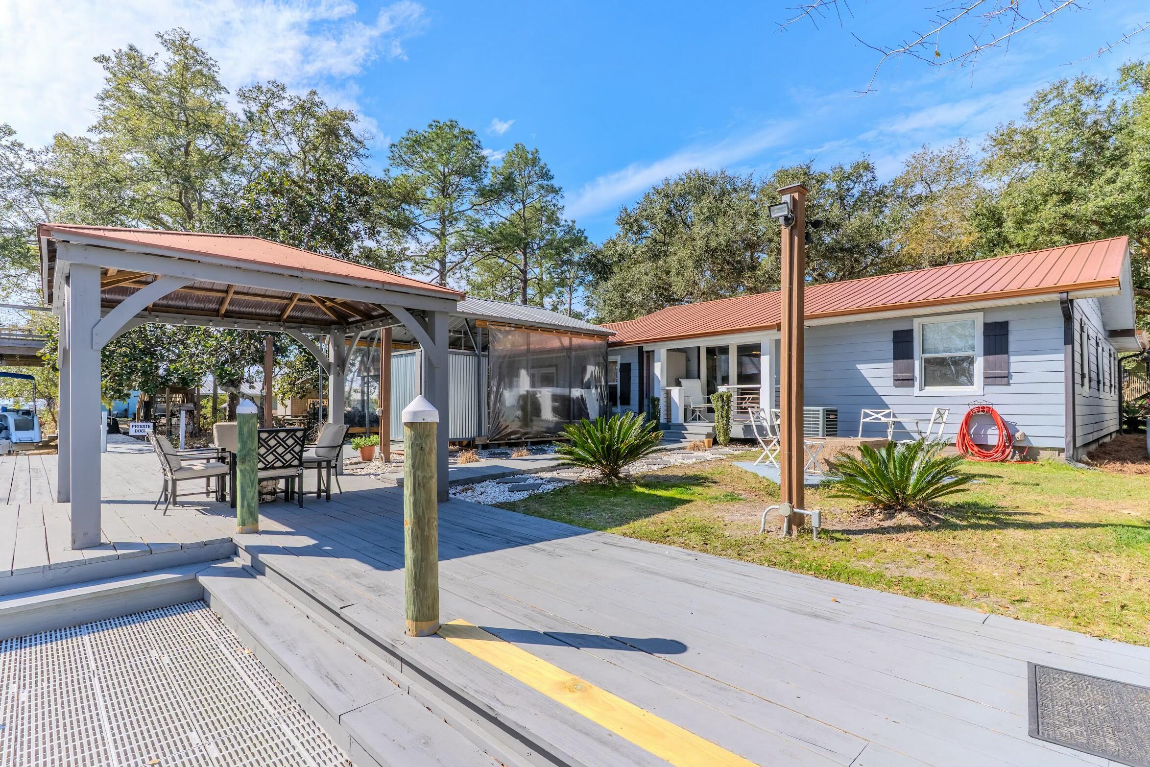 175 Ruth Road Freeport, FL 32439 - Photo 36 of 69 a view of a house with backyard and porch