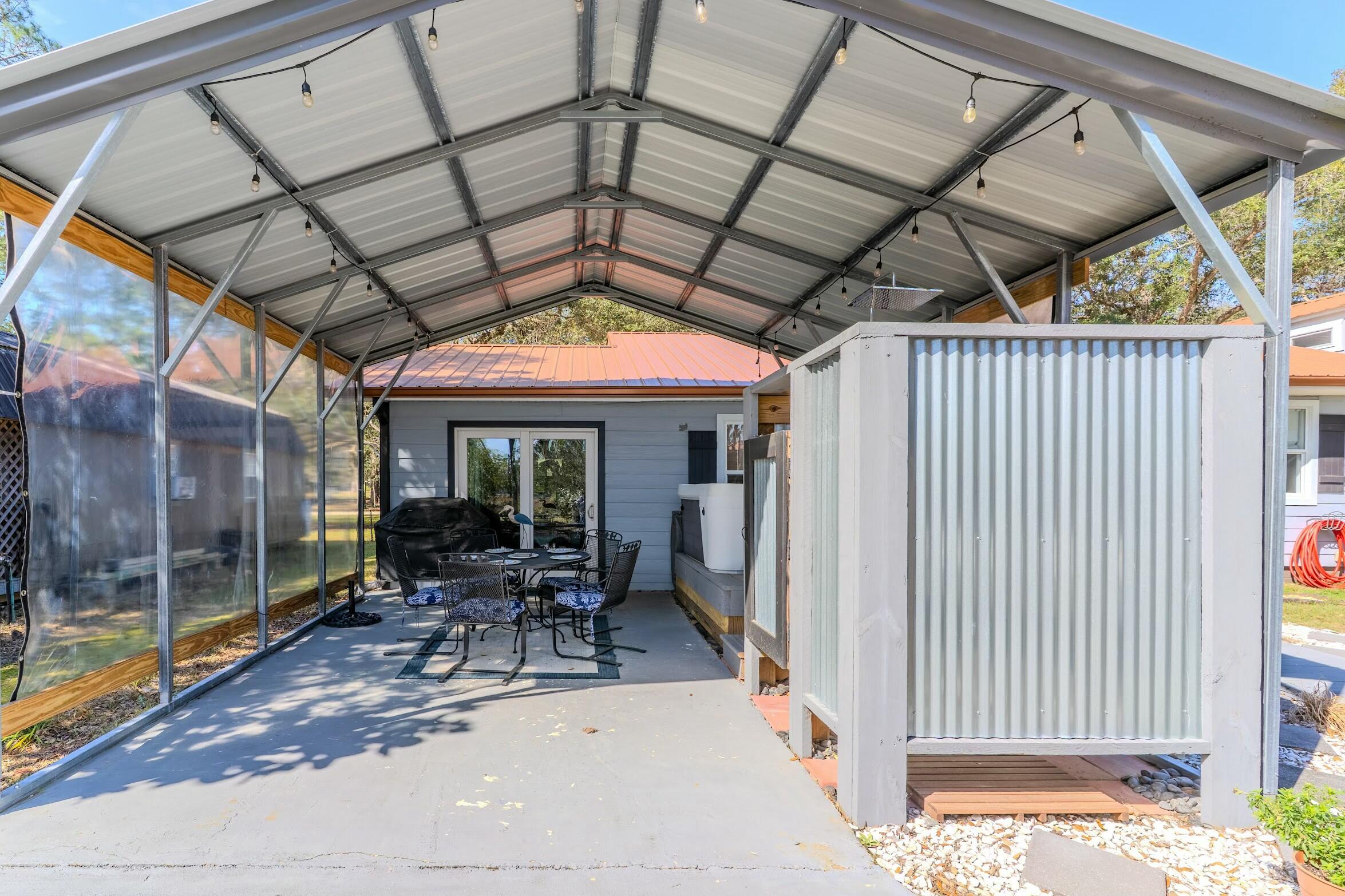 175 Ruth Road Freeport, FL 32439 - Photo 39 of 69 a building outdoor space with patio furniture and potted plants
