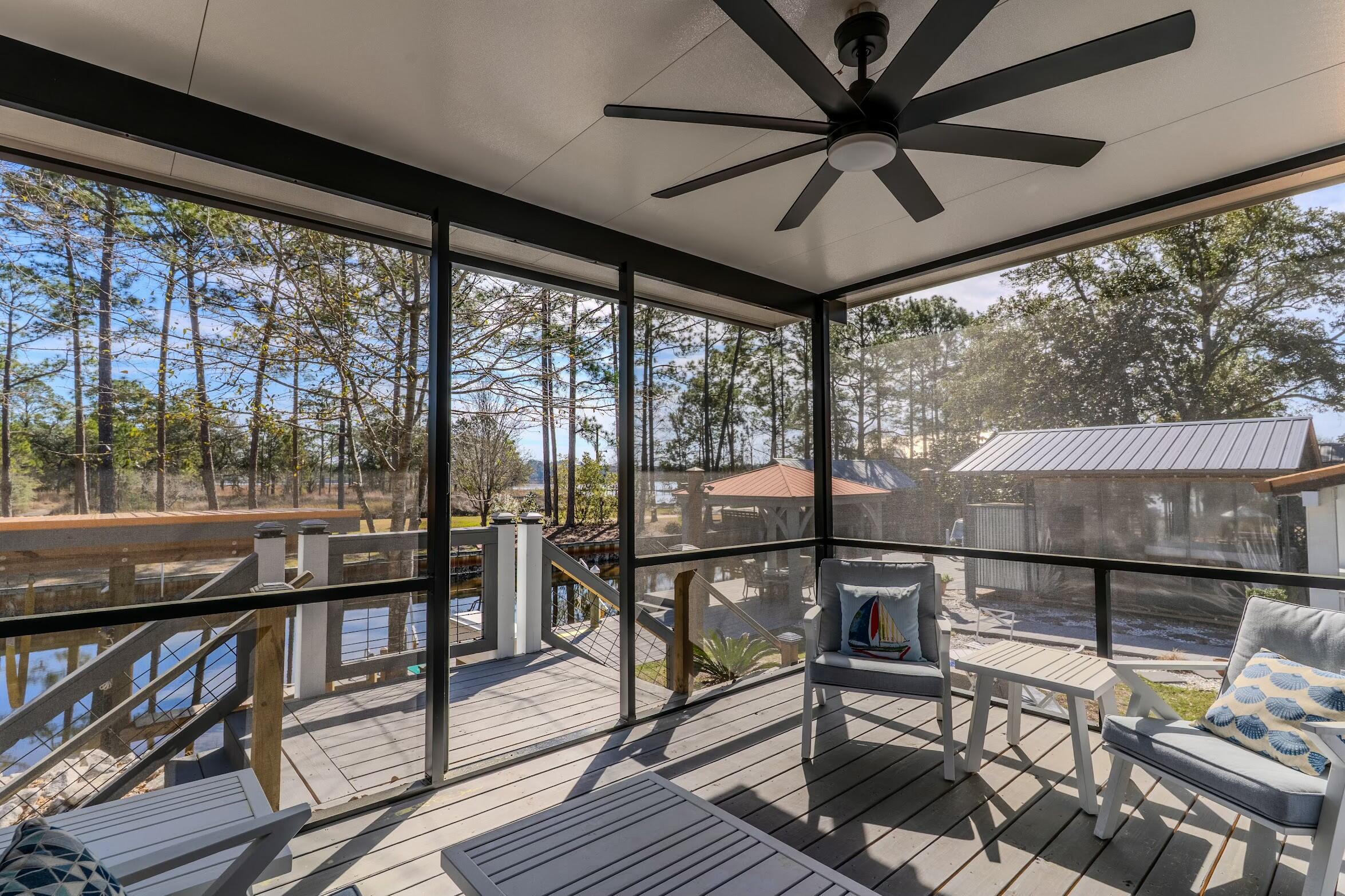 175 Ruth Road Freeport, FL 32439 - Photo 49 of 69 a view of a porch with furniture and a yard